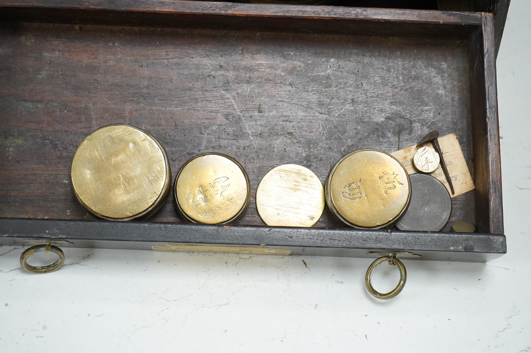 A pair of 19th century Japanese wood and brass mounted scales and weights, 31.5cm wide